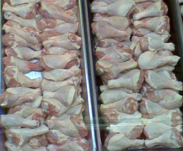 Real photograph of raw chicken drumsticks